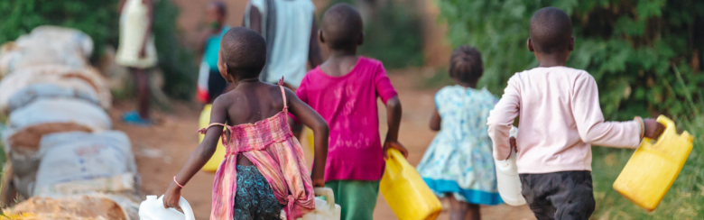 Uganda, children collecting water