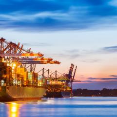 A shipyard with cargo ships and their containers